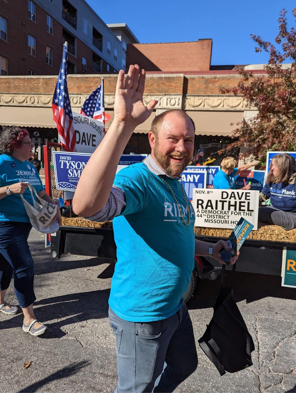 Kyle waving at a community parade