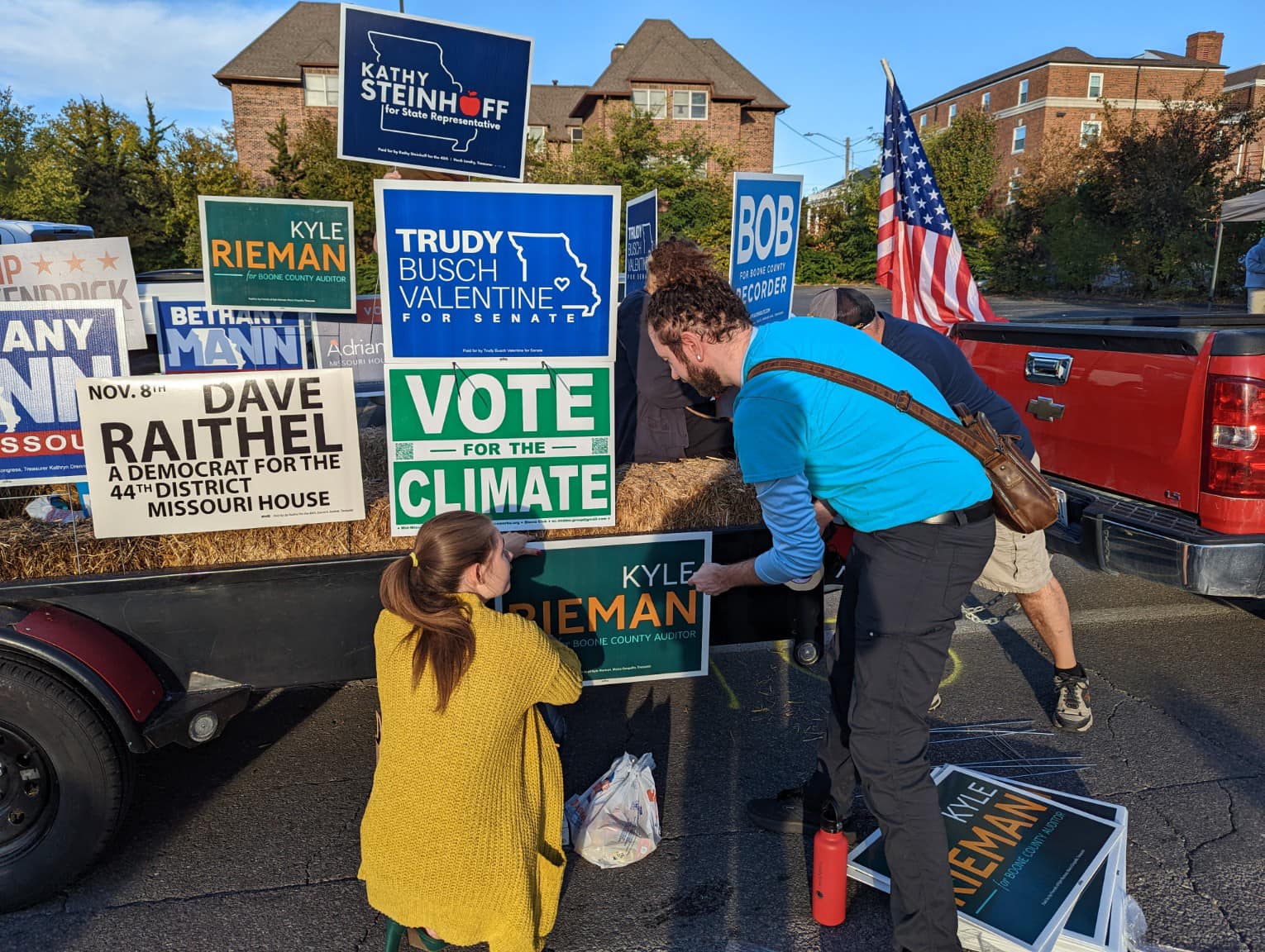 Volunteers loading yard signs